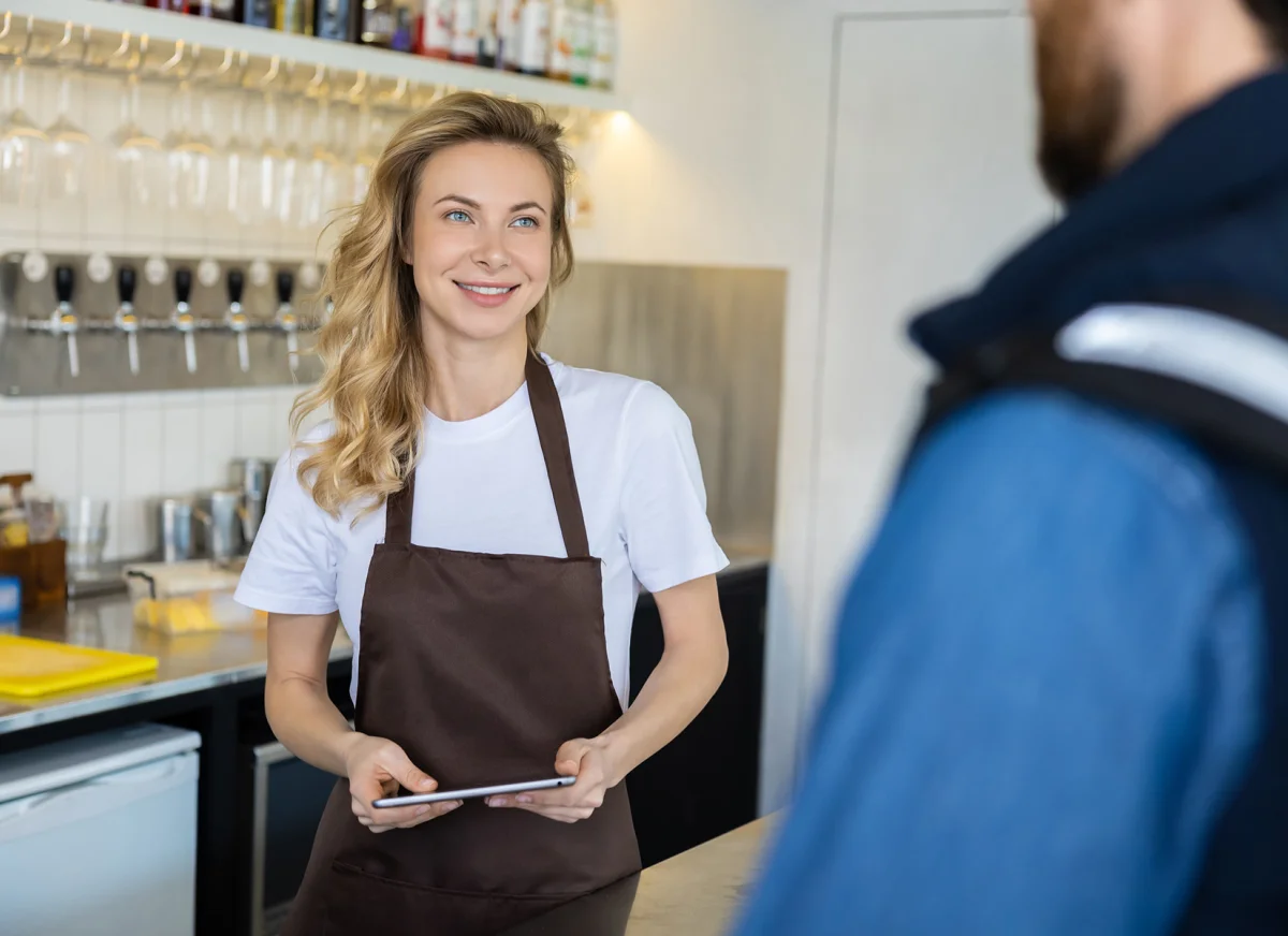 Food service employee taking delivery of goods