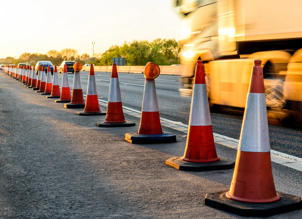 Lorry going past cones and roadworks