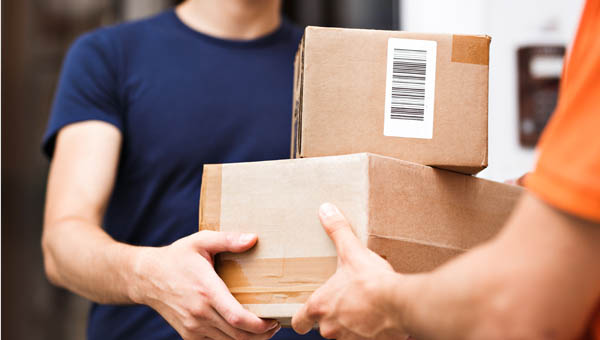 Home Delivery Route planning - Man hands over parcels on home delivery