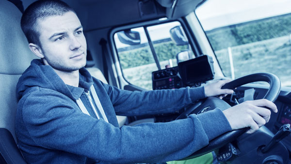 Teenager at the wheel of a HGV lorry